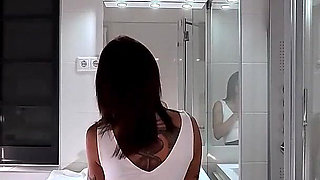 Miniskirt Lover Raver Girl Reveals Her Piercing on Her Pussy in the Bathroom by Lifting Her Short Skirt