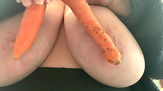 Carrots between big tits