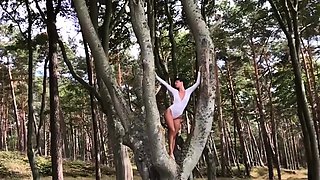 Slender German MILF strips nude outdoors