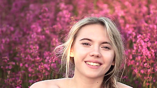 Cutie shows off her body in a flower field