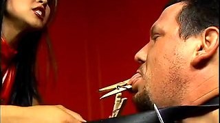 Asian dominatrix having her way with her slave