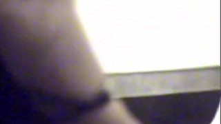 Amateur voyeur's camera recording bushy cunt taking a leak
