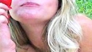 Blonde is flashing her big boobs in the outdoors