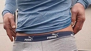 Skinny boy gets caught pissing outside, but can't stop because bladder is too full