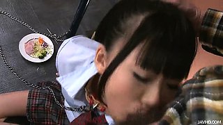 Japanese schoolgirl Chika is on her knees chained to a pole