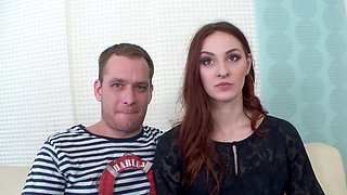 Redheaded Irina teases with sultry blowjobs in doggy while showing off her stocking-clad legs