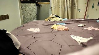 Cute amateur asian web cam girl playing with her toy