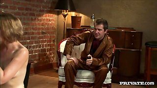 Sarah Shevon silver G-string filmed on black leather couch