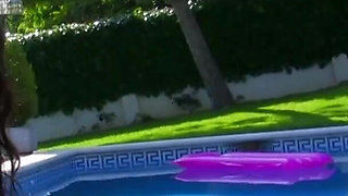 Brunette in corset fucking next to a pool