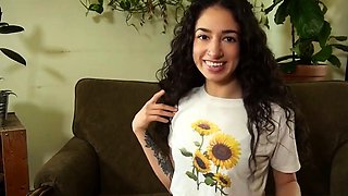 Brunette with puny funbags plays with a toy