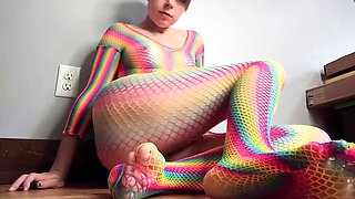 Teen in Rainbow Fishnets Fingers Herself