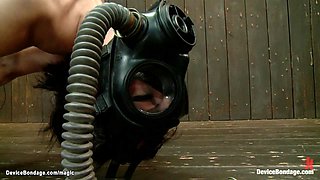 Lesbian in gas mask fisted in bondage