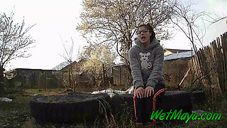 Peeing on some old tires in the yard