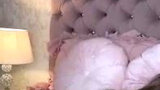 Brunette seductress working her big boobs and hot ass