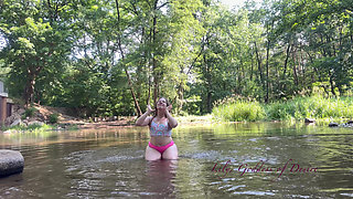 Cute Teen in Costume Playing in the River Like in a Swimming Pool