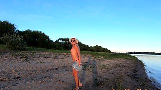 Russian Nudist on the River Shore