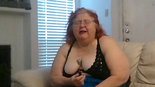 Mature BBW Redhead Nurse Vicki Talks to You as She Makes a Lipstick Applying Video for You!