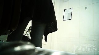 Amateur brunette with a marvelous ass pisses on hidden cam