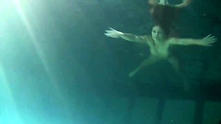 Hot fresh gingerhead teen in the dark pool shows her pussy