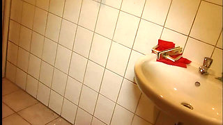 Cute Brunette Blows a Hot Cock on the Toilet