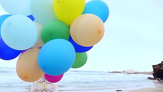 Sexy naked MILF playing with her baloons