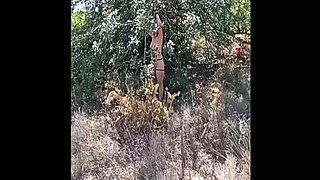 Naked Woman Tied to Tree, Story